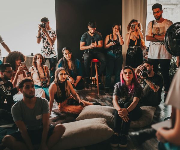 A group of diverse people practicing focus in a bright studio.